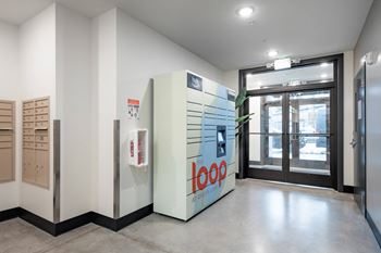 A room with a refrigerator and a glass door